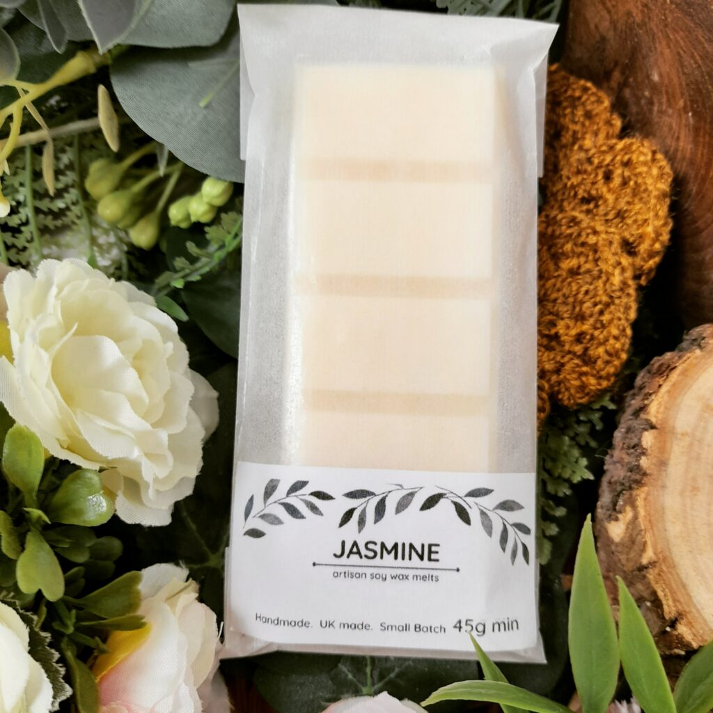 robson's retreat Jasmine scented soy wax snap bar photographed on greenery and flowers